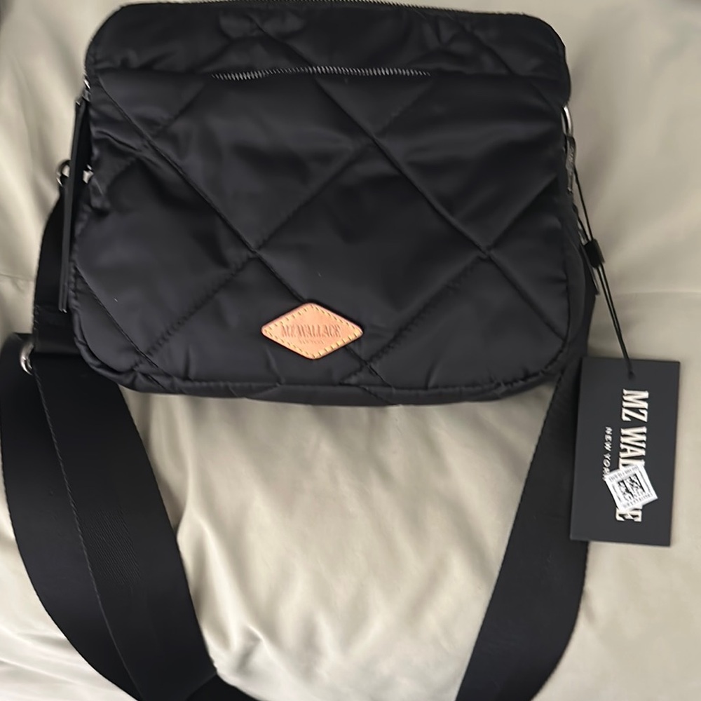 Black Quilted Messenger Bag with Adjustable Strap and Logo Patch